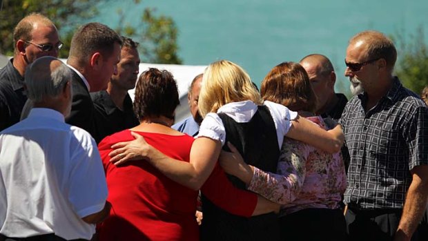 Family and friends attend a funeral service in Christchurch of a victim of February's devastating earthquake.