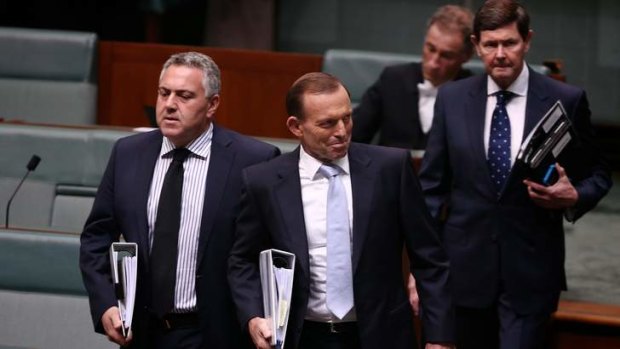Eyes to the left now please: PM Tony Abbott said he would liberate Qantas workers from the yoke of the carbon tax, but was shackled by the opposition.