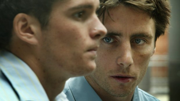 Stephen Milne, right, and Saints teammate Leigh Montagna face questioning at the Victoria Police Centre in Flinders Street in March 2004.