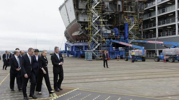 US Secretary of State Hillary Clinton, accompanied by South Australian Premier Jay Wetherall and Air Warfare Destroyer Alliance Chief Executive Officer Rod Equid, tours the Techport Australia shipbuilding facility near Adelaide.