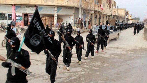 Fighters from Islamic State group marching in Raqqa, Syria in 2014.