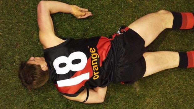 Now-retired Bomber Matthew Llyod lies motionless after being knocked out in a collision with Adam Hunter of the Eagles in 2002.