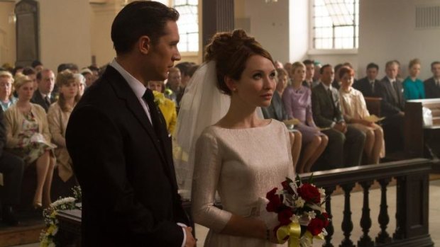 Tom Hardy as Reg and Emily Browning as his bride, a wide-eyed figure unable to escape her fate.