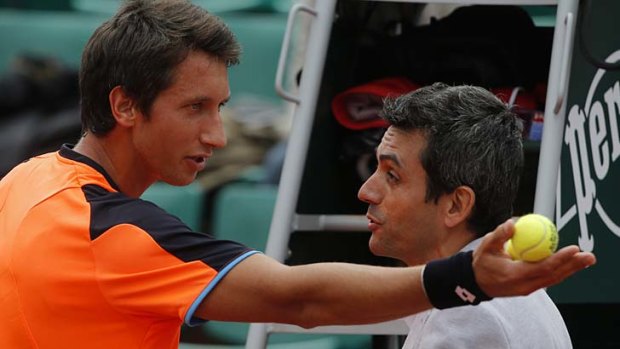 Arguing his case: Sergiy Stakhovsky challenges the umpire.