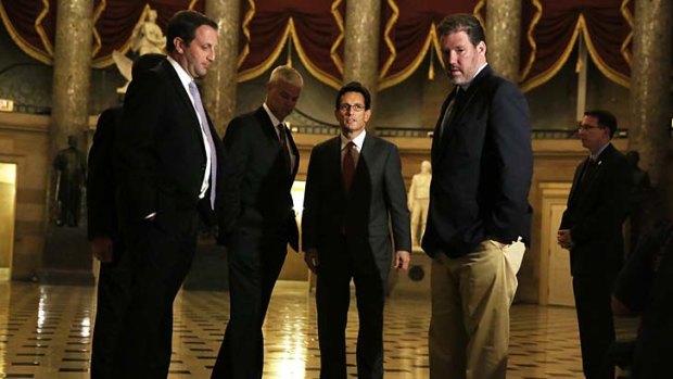 Division: Republican House leader Eric Cantor (third from left) on his way to a vote.