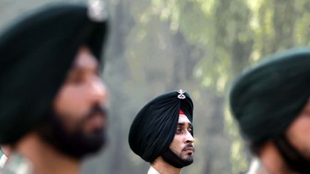 Clashes continue ... Indian soldiers pay homage to a colleague killed in a battle with rebels.