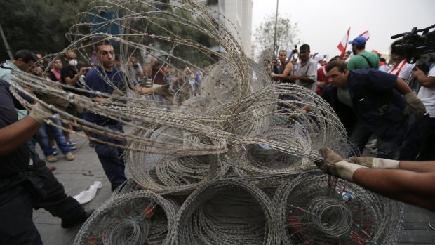 Barbed wire blocking a road in Beirut near Lebanon's parliament on Wednesday.
