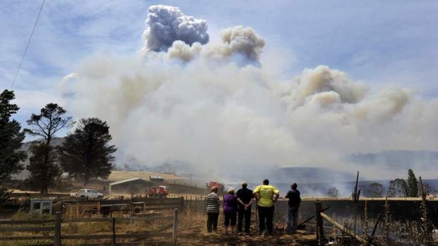 Residents watch the fire on Mount Forest Road near Cooma.