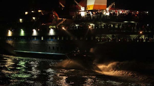 INTERNATIONAL WATERS ...  activists look on as Israeli boats close in on the Mavi Marmara.