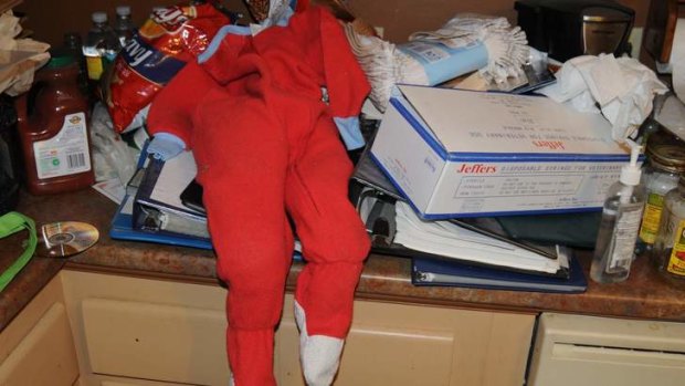 A set of child's pyjamas and a box of syringes are shown in the Massachusetts home of would-be killer and cannibal Geoffrey Portway.