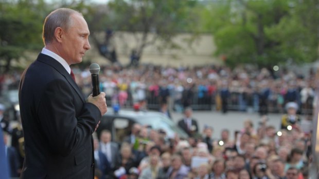 Vladimir Putin addresses residents during a visit to the Crimean port of Sevastopol.