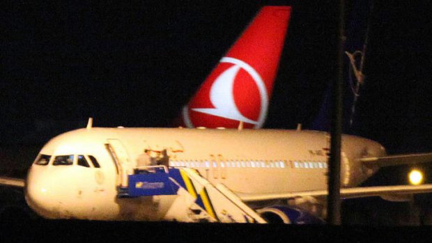 Confrontation ... The Syrian passenger plane is seen after it was forced to land at Ankara airport.