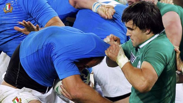 Sergio Parisse shows Mike Phillips the way when it comes to taking on Ireland's Conor Murray.