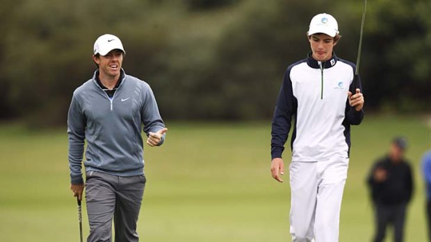 Good company: Ryan Ruffels (right) with Rory McIlroy.