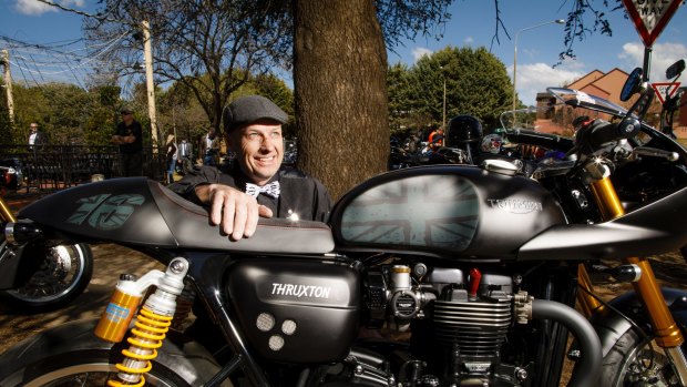 The organised of the Distinguished Gentleman's Ride in Canberra, Simon Whittaker, poses with his Triumph motorbike. 
