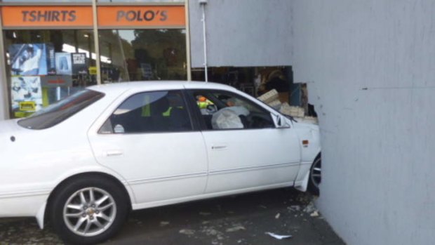 A car smashed into the "Action Sports Wear" shop front wall early Saturday.