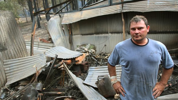 Peter Sands stands in the remains of his toolshed. "I'm relieved it was just the shed," he said.
