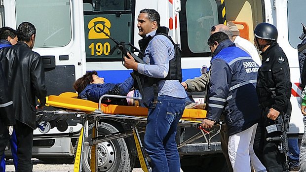 A victim is evacuated outside the Bardo Musum in Tunis.