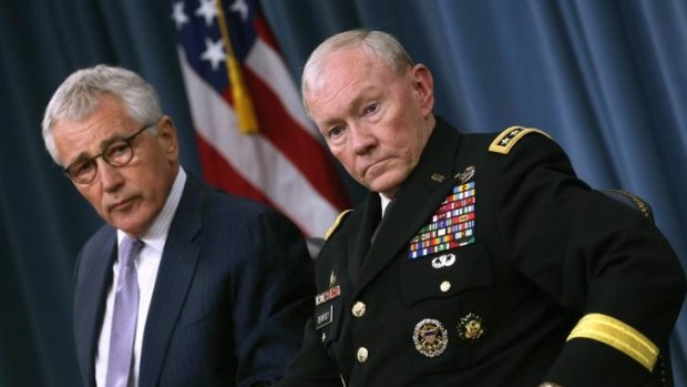 Secretary of Defence Chuck Hagel (left) and Chairman of the Joint Chiefs of Staff General Martin Dempsey speak to the media during a press briefing at the Pentagon.