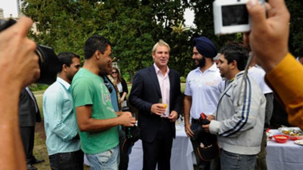 Cricket great Shane Warne has a yarn with Indian students at today's lunch.