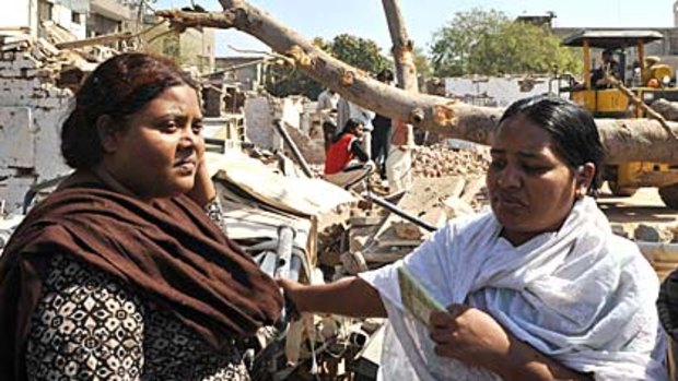Pakistani Christian women stand beside their destroyed houses a day after a car bomb attack in Lahore. Pakistan’s Taliban faction claimed responsibility for the attack.