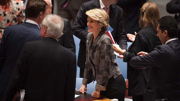 Australian Minister of Foreign Affairs Julie Bishop talks to other attendees before a Security Council meeting on small arms, during the 68th United Nations General Assembly at UN headquarters in New York.