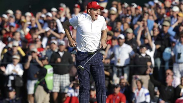 USA's Keegan Bradley reacts after almost making a long eagle putt on the 15th hole at the Medinah Country Club.