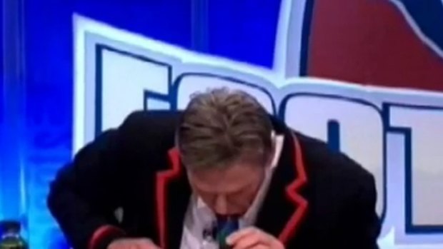 Did he inhale? ... Sam Newman smokes a 'tea' bong on The Footy Show.