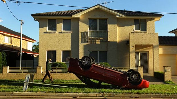 Party night: This car was overturned in Wentworthville.