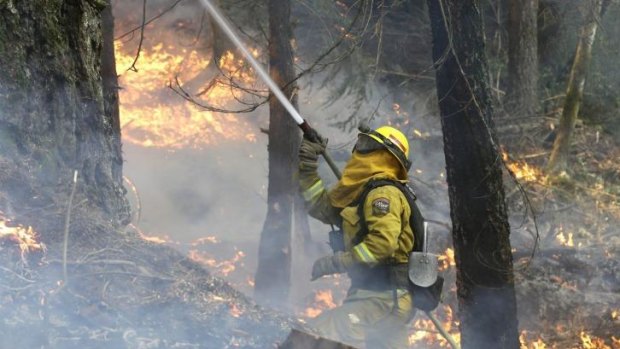 A firefighter battles the King fire near Fresh Pond, California.