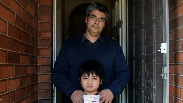 Loss ... Diego Dominguez with his son Jamie who was one month old when his grandfather Alberto was killed.