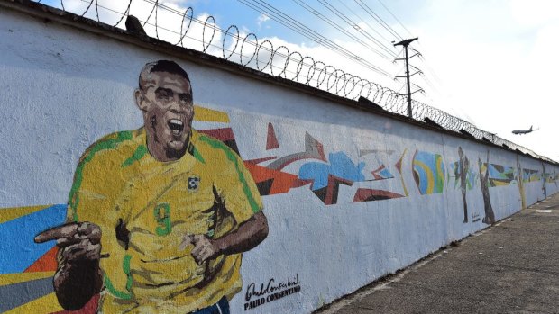 Graffiti depicting Brazilian star Ronaldo outside Sao Paulo's airport.