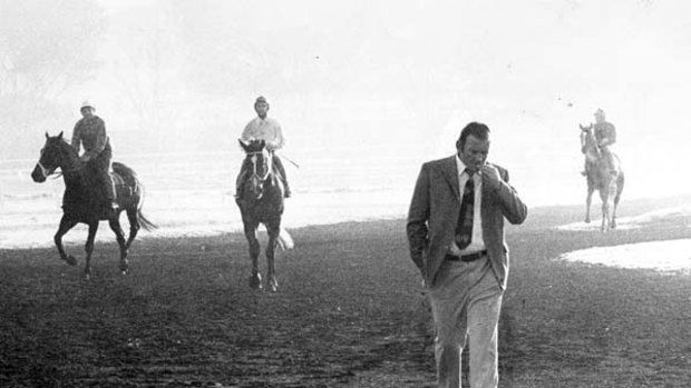 The best of the press ... Bill Casey attends early morning trackwork in 1973.