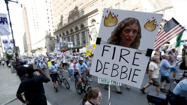 Supporters of Vermont senator  Bernie Sanders call for the sacking of Debbie Wasserman Schultz in Philadelphia on Sunday.  