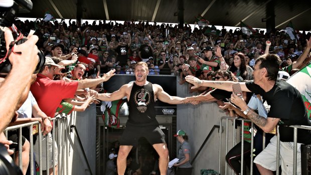 Glory, glory, hallelujah: Tom Burgess greets the fans at Redfern on Monday.