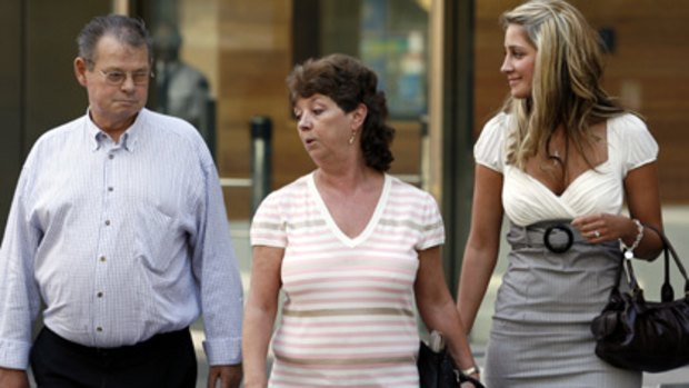 George and Barbara Williams leave the County Court in Melbourne with a mystery blonde after one of their son's trials in 2007.