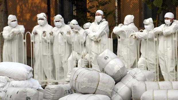 Protection &#8230; staff at a hospital for SARS patients in Beijing during the outbreak of the disease in 2003. <em>Photo: AP/Wang Jianmin</em>