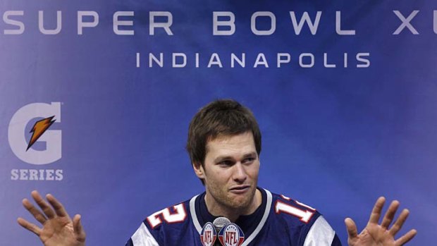New England Patriots quarterback Tom Brady answers questions during media day for the NFL Super Bowl XLVI.
