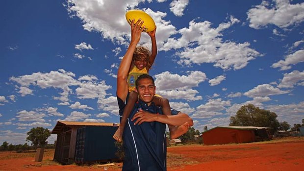 Role model: Dom Barry was a hit on a visit to Yuendumu School this week.