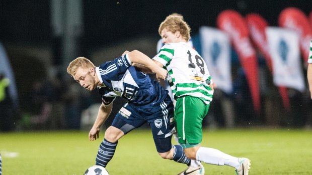 Connor Pain of the Melbourne Victory and Sean Kiddey of Tuggeranong United in last year's FFA Cup match at Viking Park. 