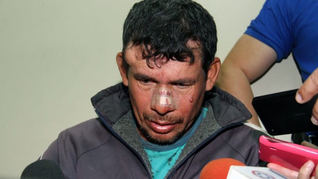 Claiming innocence ... Gilberto Benitez Zarate, accused of raping his 10-year-old stepdaughter, is hounded by the press after being arrested in Asuncion, Paraguay. 