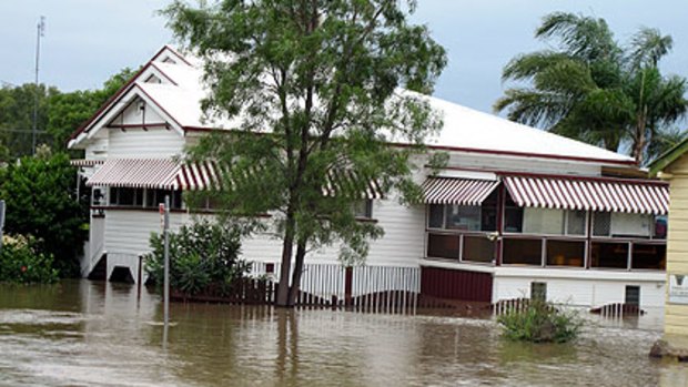 Colleen Drabsche's house succumbs to flood waters in Chinchilla.