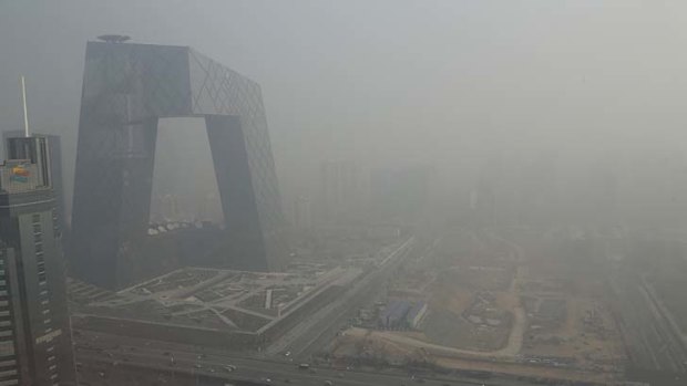 Shrouded in haze ... the China Central Television (CCTV) building in Beijing.