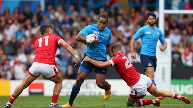  Samuela Vunisa of Italy is tackled by Conor Trainor and Van Der Merwe of Canada during the 2015 Rugby World Cup Pool D match.