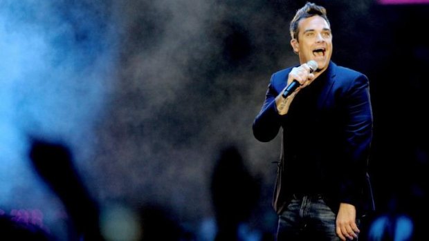 Having a ball: Robbie Williams is back being a pop star.