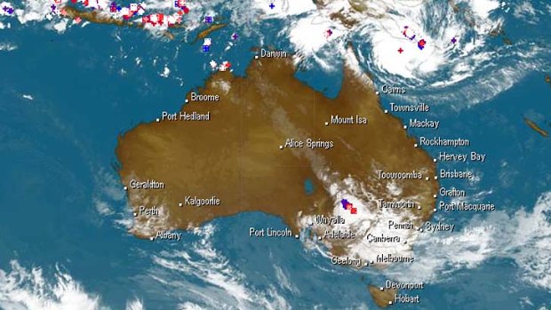 A satellite image showing cyclone Ita bearing down on north Queensland.