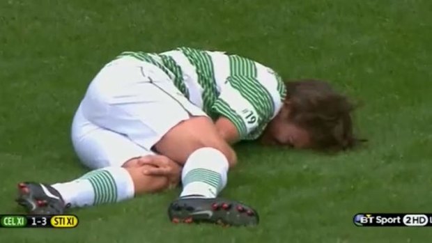 One Direction's Louis Tomlinson after being felled in a UK charity football match.