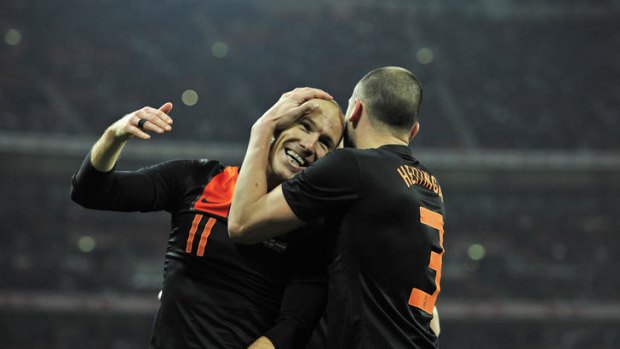Dutch delight ... Arjen Robben (L) celebrates his winning goal for the Netherlands.