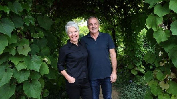 Gardener Anne-Maree Eckersley and her husband Ross pose for a photo in the garden of their Surrey Hills home.