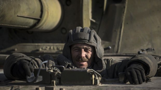 A Ukrainian soldier looks near Artemivsk, eastern Ukraine.